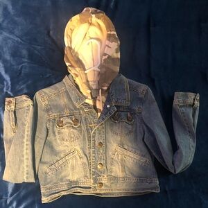 Jean jacket with camo hoodie.